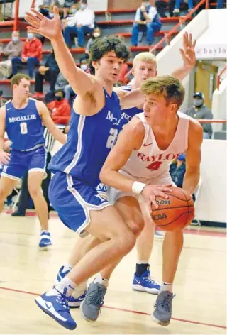  ?? STAFF PHOTO BY MATT HAMILTON ?? Baylor’s Troy Boynton, right, looks for an open teammate while guarded by McCallie’s Boon Elliott during Friday night’s game at Baylor’s Duke Arena. Baylor won 42-33 and will visit McCallie on Tuesday.