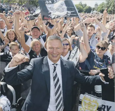  ?? PICTURE: JAMES HARDISTY ?? ONE DOWN, TWO TO GO: Hull FC chairman Adam Pearson celebrates with the fans at the Challenge Cup homecoming.