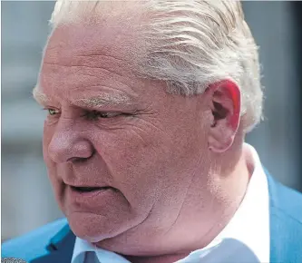  ?? MARTA IWANEK THE CANADIAN PRESS ?? Ontario Premier-designate Doug Ford speaks to reporters before heading into Whitney Block for a meeting with his transition team in Toronto, on Sunday.