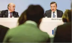  ?? EPA PIC ?? European Central Bank (ECB) president Mario Draghi (right) and ECB vice-president Luis De Guindos at a press conference following the meeting of the ECB Governing Council in Frankfurt yesterday.