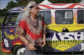  ?? SETH WENIG - ASSOCIATED PRESS ?? A man who calls himself “Run-A-Way Bill” stands in front of a Volkswagen bus while waiting for the gates to open at a Woodstock 50th anniversar­y event in Bethel, N.Y.