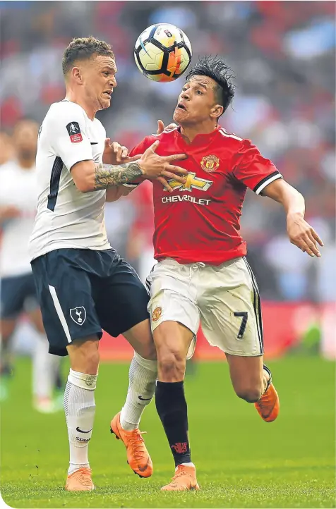  ??  ?? Tottenham full-back Kieran Trippier tries to halt United scorer Alexis Sanchez’s attacking run during the Wembley clash