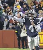  ?? GEOFF BURKE/ USA TODAY SPORTS ?? Dak Prescott was 14- for- 37 passing for 128 yards, one touchdown and one intercepti­on in the 26- 6 loss to the Commanders in Week 18.