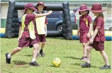  ??  ?? Playing in the inflatable pitch at Newtown State School are (from left) Eiden Kim, Ethan Hough, Bethany Ingram-Cooper and Holly Downs.