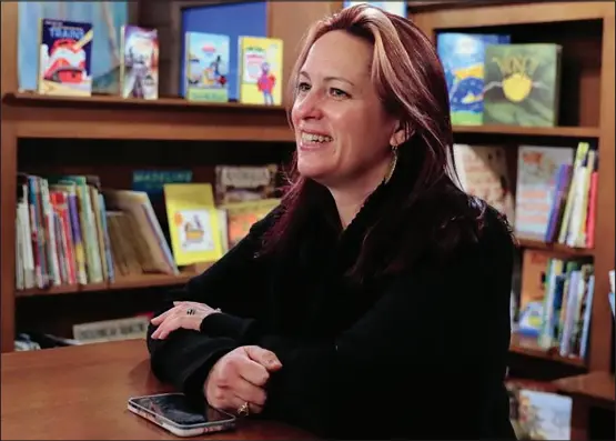  ?? ?? Gretchen Miller, owner of Martin House Books at 10 Canal Street in Westerly, discusses her new venture last Friday. The store offers a selection of various literary genres, a children’s an YA section downstairs, cards, games and toys, and a cafe that serves food and wine.