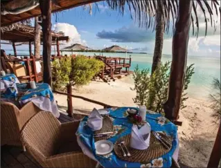  ?? STEVE HAGGERTY, TNS ?? Brunch, lunch or a swim, life is easy at Aitutaki Lagoon Resort.