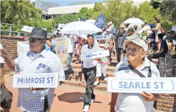  ?? PICTURE: AYANDA NDAMANE ?? LEST WE FORGET: Former residents of District Six on the Walk of Remembranc­e. On February 11, 1966, District 6 was declared a whites-only residentia­l area.