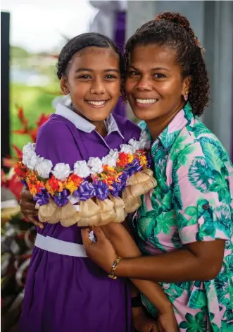  ?? Photo: after Leon Lord ?? Dudley Intermedia­te School senior prefect Jane Naua alongside her mother Lusia Holmes their school prefect induction in Toorak on May 20, 2022.