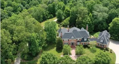  ??  ?? LOCATED IN THE EXCLUSIVE FOREST CREEK COMMUNITY IN OOLTEWAH, THIS ESTATE BOASTS BEAUTY INSIDE AND OUT.