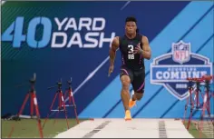  ?? AP PHOTO / MICHAEL CONROY ?? Penn State running back Saquon Barkley runs the 40-yard dash at the NFL football scouting combine in Indianapol­is, Friday.