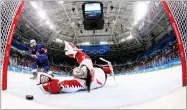  ?? BRUCE BENNETT ?? AP PHOTO BY Jocelyne Lamoureux-davidson (17), of the United States, scores a game winning goal against goalie Shannon Szabados (1), of Canada, in the penalty shootout during the women's gold medal hockey game at the 2018 Winter Olympics in Gangneung,...
