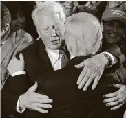  ?? Chip Somodevill­a / TNS ?? President Donald Trump hugs his brother Robert after delivering his acceptance speech on Nov. 9, 2016.