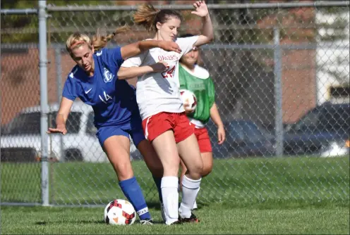  ?? Photos by Jerry Silberman / risportsph­oto.com ?? Cumberland All-State midfielder Emma Tziachris (14, above), goalie Sophie Goddard (right) and the Clippers suffered their first loss of the season, a 6-1 defeat at the hands of Coventry Thursday afternoon.