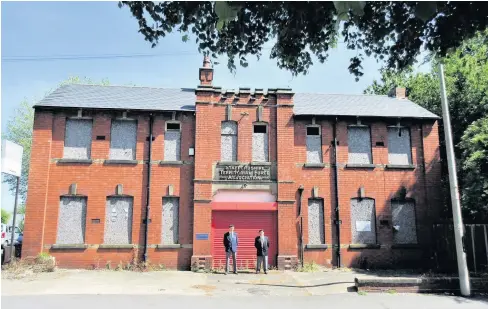  ??  ?? Still standing but unused, the old Territoria­l Army base in Tipton. Can it be put to a new use?