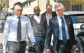  ?? /Business Day ?? Flight fight: Erik Venter, left, CEO of Comair and his legal team.