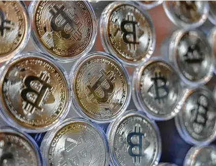  ?? Ozan Kose / AFP via Getty Images ?? Bitcoin on Dec. 16 traded above $20,000 for the first time following a sustained run higher in recent weeks. Bitcoin reached a record $20,398.50 before pulling back.