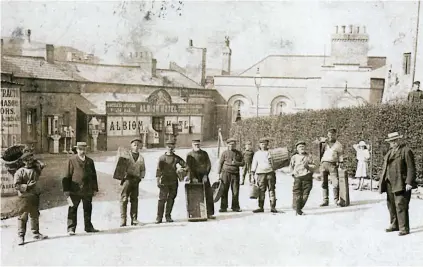  ??  ?? Robert Koya-Rawlinson’s postcard shows fishermen – including George Hooper – in Castle Square, Tenby, in 1908