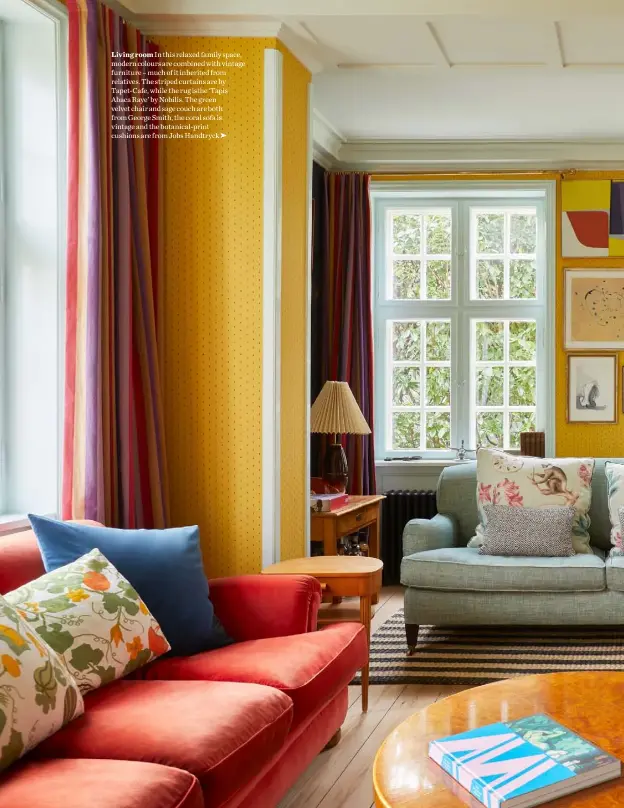  ??  ?? Living room In this relaxed family space, modern colours are combined with vintage furniture – much of it inherited from relatives. The striped curtains are by Tapet-Cafe, while the rug isthe ‘Tapis Abaca Raye’ by Nobilis. The green velvet chair and sage couch are both from George Smith, the coral sofa is vintage and the botanical-print cushions are from Jobs Handtryck