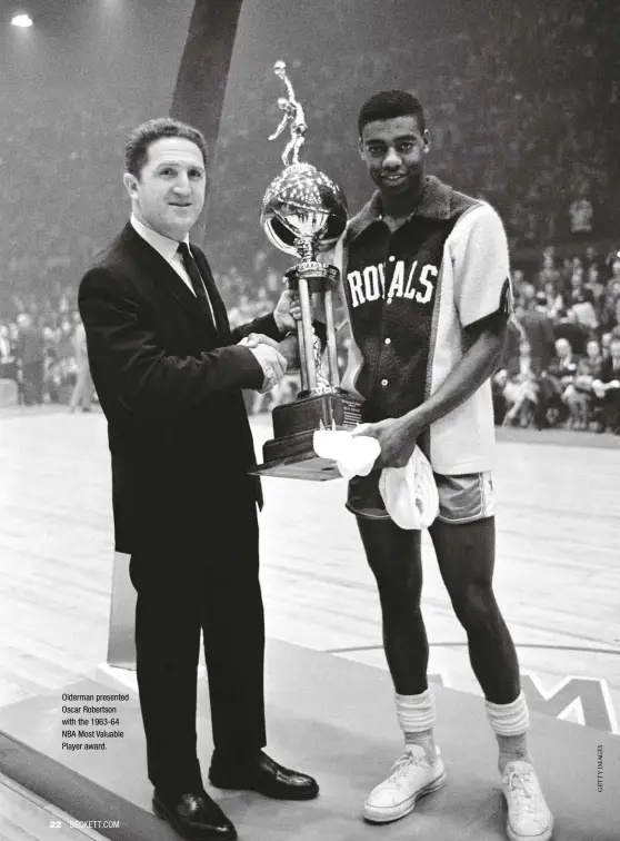  ??  ?? Olderman presented Oscar Robertson with the 1963-64 NBA Most Valuable Player award.