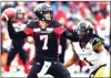  ?? The Canadian Press ?? Ottawa Redblacks Trevor Harris throws the ball as Hamilton TigerCats Don Unamba defends in Ottawa on Sunday