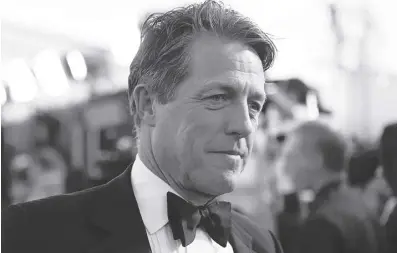  ?? (Photo by Richard Shotwell/ Invision/ap, File) ?? HUGH GRANT arrives at the 23rd annual Screen Actors Guild Awards at the Shrine Auditorium & Expo Hall in Los Angeles, Sunday Jan. 29, 2023. A London court on Friday rejected an attempt by the publisher of The Sun tabloid to throw out a lawsuit by actor Hugh Grant alleging that journalist­s and investigat­ors it hired illegally snooped on him.