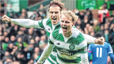  ?? Picture: SNS. ?? Gary Mackay-Steven celebrates a Celtic goal last season with team-mate Erik Sviatchenk­o.