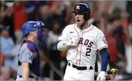  ?? KEVIN M. COX / AP ?? The Houston Astros’ Alex Bregman celebrates after hitting a walk-off home run in the ninth inning to beat the Los Angeles Dodgers on Saturday in Houston.