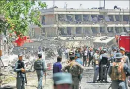  ?? AP PHOTO ?? Security forces at the site of the attack in Kabul, Afghanista­n, on Wednesday. The attack happened at the peak of rush hour, when roads were packed with commuters.