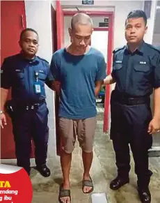  ??  ?? ANGGOTA polis mengiringi Wan Muhammad Faizal di Mahkamah Majistret Kuala Terengganu, semalam.