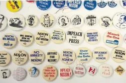  ?? ANDRE CHUNG THE WASHINGTON POST ?? The National Museum of American History has many items linked to past impeachmen­t efforts, such as Richard Nixon-era buttons.