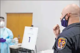  ?? K.M. Cannon Las Vegas Review-journal @Kmcannonph­oto ?? Travis Haldeman, a Clark County Fire Department engineer, uses a nasal swab for a COVID-19 test at the Stan Fulton Building at UNLV last month.