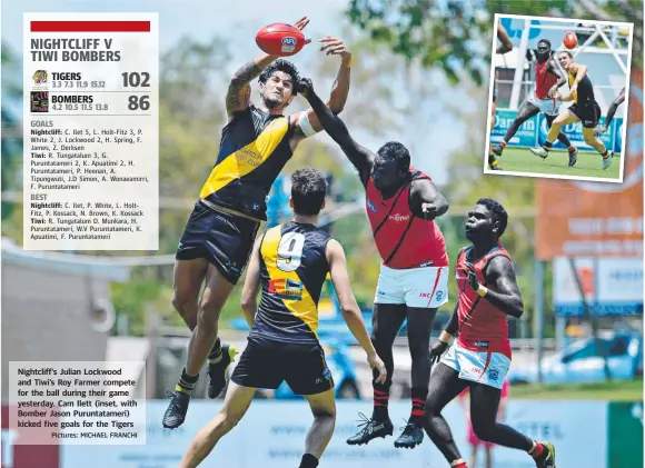  ?? Pictures: MICHAEL FRANCHI ?? Nightcliff’s Julian Lockwood and Tiwi’s Roy Farmer compete for the ball during their game yesterday. Cam Ilett (inset, with Bomber Jason Puruntatam­eri) kicked five goals for the Tigers