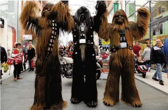  ??  ?? High and mighty Keith Armour (centre) in his costume with his wookiee pals