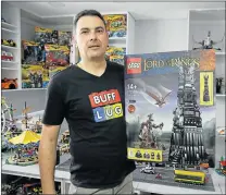  ??  ?? MISSION ACCOMPLISH­ED: Botha holds up a 2 350 piece Tower of Orthanc set from the ‘Lord of the Rings’ range which he has had from 2013 and has yet to build