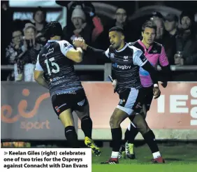  ??  ?? &gt; Keelan Giles (right) celebrates one of two tries for the Ospreys against Connacht with Dan Evans