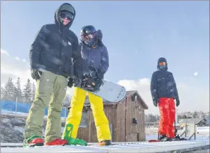  ?? GREG MCNEIL/CAPE BRETON POST ?? Matthew Gillespie, Leah Gillespie and Avery Gale were among the hundreds of skiers and snowboarde­rs to enjoy opening day at Ski Ben Eoin on Wednesday.