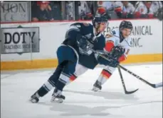  ?? PHOTO ADIRONDACK THUNDER/ANDY CAMP ?? The Thunder’s Kenton Miller, right, battles a Worcester opponent in ECHL Kelly Cup playoff action. Adirondack won, 3-1, on Sunday for a 2-1 series lead. Game 4 is at 7 p.m. Wednesday in Glens Falls.