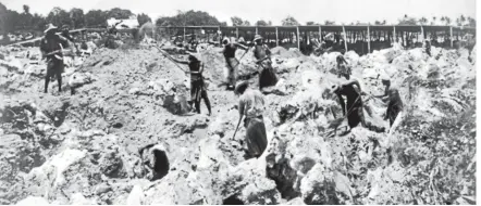  ?? ALEXANDER TURNBULL LIBRARY REF: PACOLL-6044-01 ?? Workers dig for phosphate on Banaba, the Kiribati island formerly known as Ocean Island.