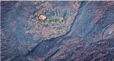  ?? REU ?? Die Lavaströme verschling­en auch dieses Haus auf La Palma.