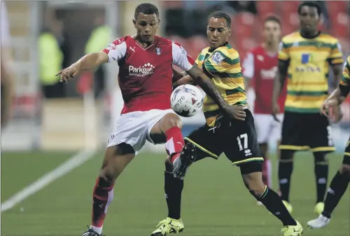  ?? PICTURE: TIM GOODE/PA ?? PRESSING HIS CLAIM: Rotherham United’s Jonson Clarke-Harris, left, battles with Norwich City’s Elliott Bennett at the New York Stadium.