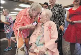  ?? Gary Coronado Los Angeles Times ?? OPAL GOODE, center, celebrates her 112th birthday with fellow residents of Ridgecrest, Calif., a month before consecutiv­e quakes rocked the city of 29,000.