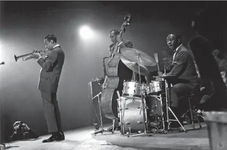  ??  ?? Young man with a trumpet: Lee Morgan, left, with Art Blakey’s Jazz Messengers (Blakey on drums)