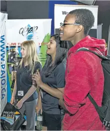  ?? POSTMEDIA NETWORK FILE ?? Assumption College students Izzy White, Teena Bhagat, and Justus Alexander attend the Epic Jobs job fair at Galaxy Cinemas in Brantford, Ont., earlier this month.