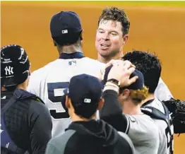  ?? TONY GUTIERREZ AP ?? Corey Kluber is congratula­ted after his no-hitter vs. the Rangers on Wednesday.