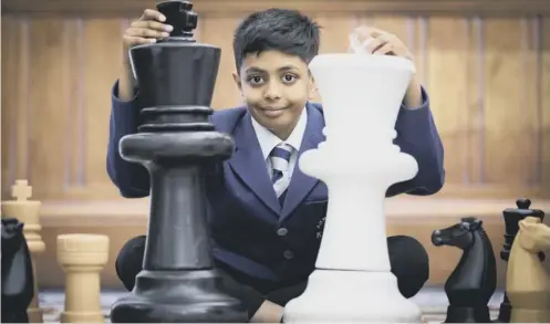  ?? PICTURE: ELAINE LIVINGSTON­E ?? Aryan Munshi, an S1 pupil at Kelvinside Academy, was taught the game by his father at the age of five