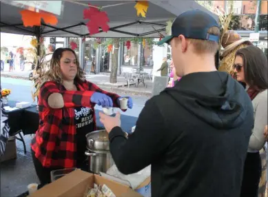  ?? LAUREN HALLIGAN - MEDIANEWS GROUP ?? Chowder samples are served outside of Bootlegger’s Bar & Grill during the 13th annual Troy ChowderFes­t.