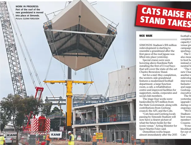  ?? Picture: GLENN FERGUSON ?? WORK IN PROGRESS: Part of the roof of the new grandstand is moved into place at Simonds.