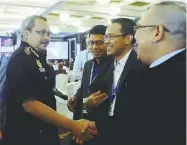  ?? BERNAMAPIX ?? Dzulkifli being greeted by participan­ts at the 9th Internatio­nal Conference on Financial Crime and Terrorism Financing yesterday.