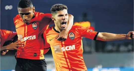  ?? PHOTO: REUTERS ?? How about that? Shakhtar Donetsk forward Manor Solomon (right) celebrates with teammate Tete after scoring his side’s third goal in its Champions League match against Real Madrid in Madrid yesterday. Shakhtar won 32.