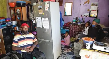  ?? News Agency (ANA) PHANDO JIKELO African ?? WHEELCHAIR-BOUND Siyabulela Bambiso, 65, and his partner, Nopink Ndongeni, 51, live in a one-room shack in KTC with their children and eight grandchild­ren. The family depends on Siyabulela’s social grant as Nopink can’t get her identity document. |